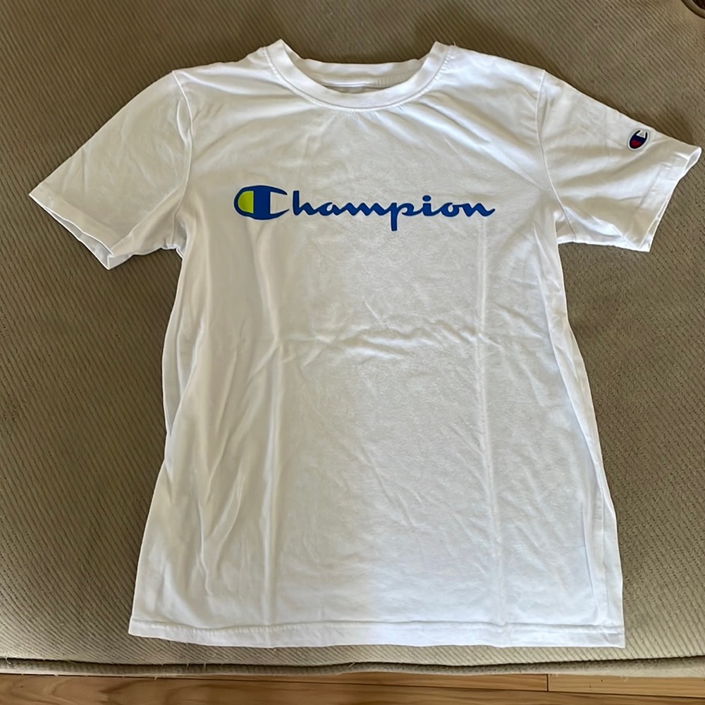 This is a new champions shirt thats not been worn more than once